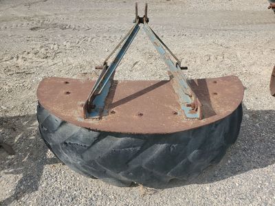 Tire tractor mount scraper