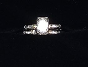 Gorgeous .50 carat emerald cut diamond engagement set!