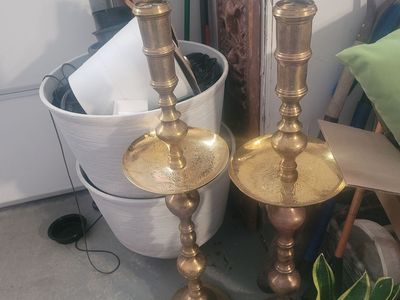 large, ornate items are vintage Moroccan-style brass altar candlesticks, dating from the mid-20th century.