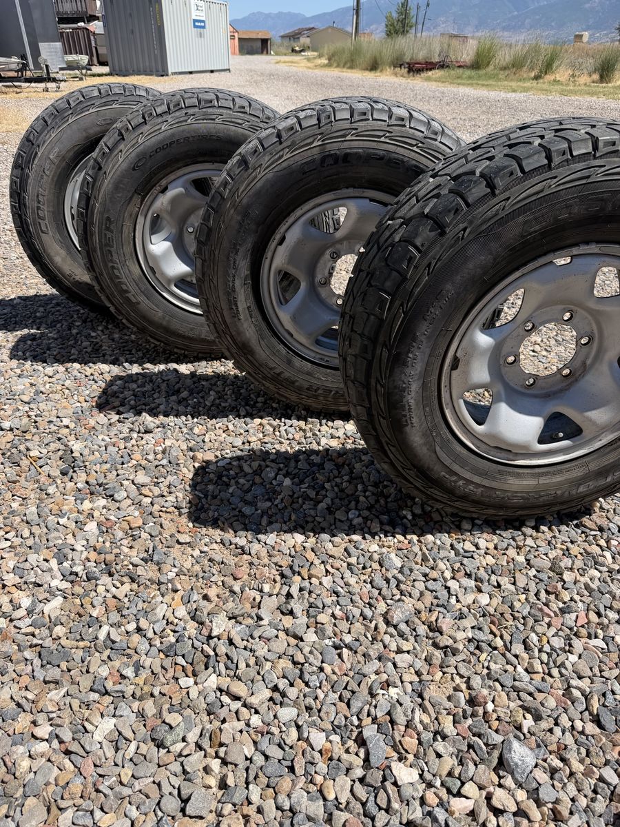 Cooper Discoverer AT3 Tires (Set of 4) on Steel Rims - 245/75R16