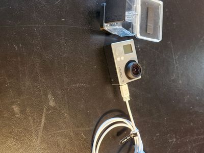 GoPro Hero3 camera, charging chord, and waterproof case. Works great. Charges well.