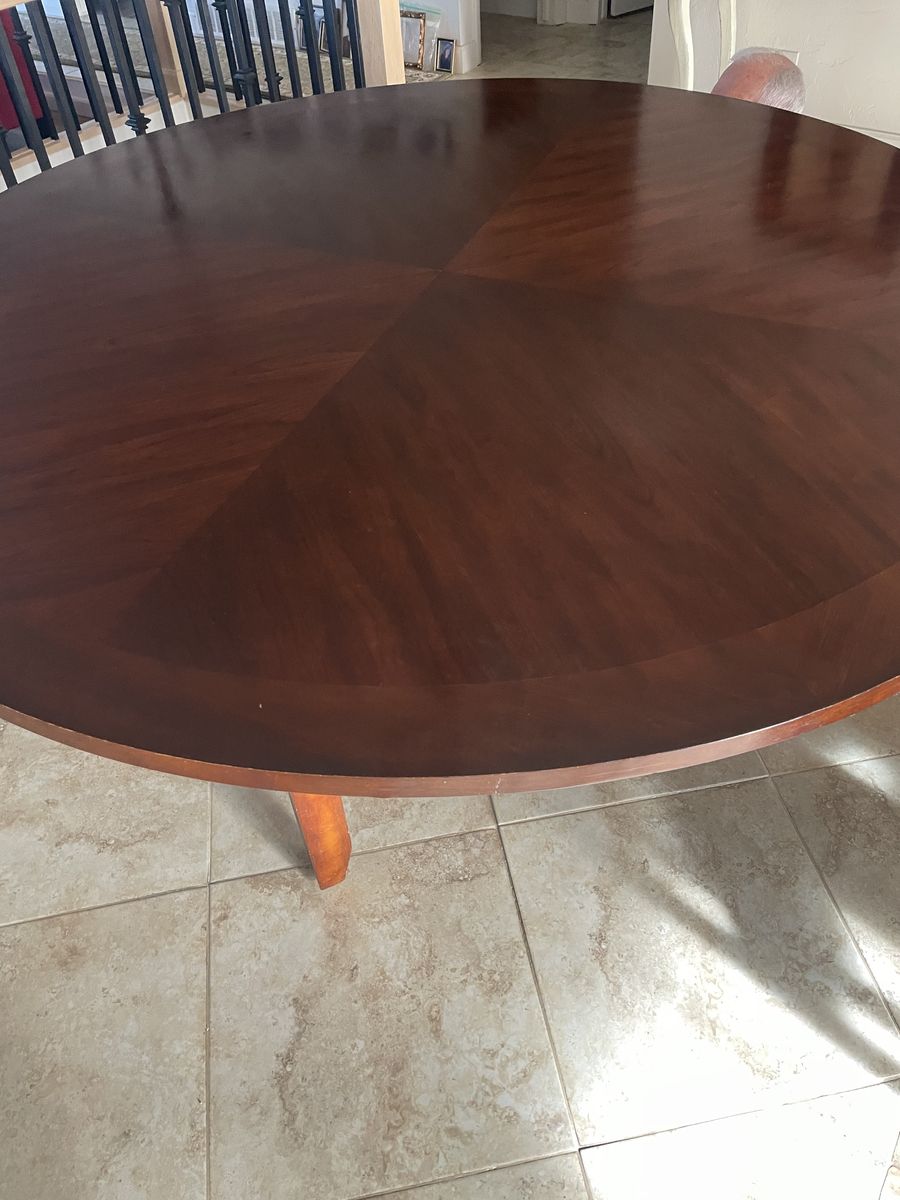 6 foot round dining table with 40 inch glass Lazy Susan and 8 Parson chairs.