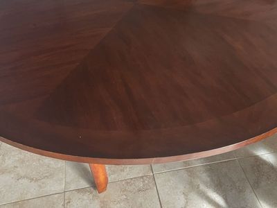 6 foot round dining table with 40 inch glass Lazy Susan and 8 Parson chairs.