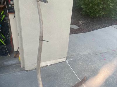 vintage antique scythe, often referred to as a "Grim Reaper" farming tool