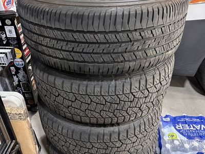 2022 Ford Ranger 265/60 r18 tires and black stock wheels.