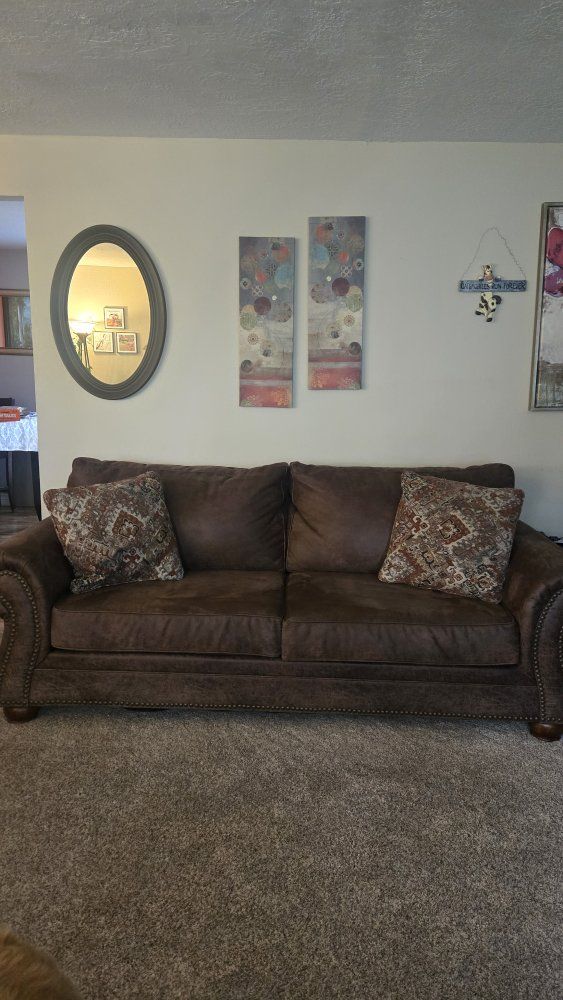 Comfortable Brown Sofa with Nailhead Trim and Decorative Pillows - Excellent Condition