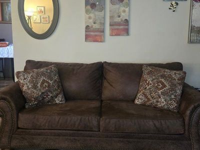 Comfortable Brown Sofa with Nailhead Trim and Decorative Pillows - Excellent Condition