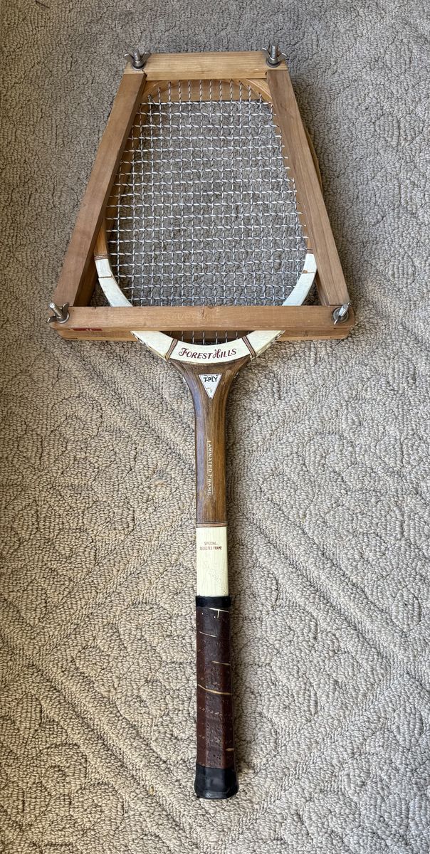 Vintage Forest Hills wooden tennis racket with the original wooden racket press included.