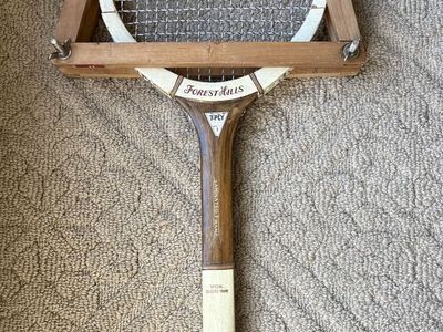 Vintage Forest Hills wooden tennis racket with the original wooden racket press included.