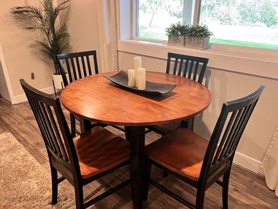 Round Wood Table With Foldable Leaves and 4 Chairs
