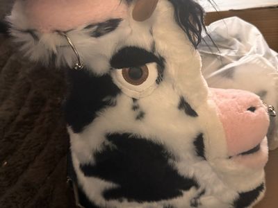 dELiA*s by Dolls Kill® Wildlife Novelty Cow Faux Fur Platform Booties