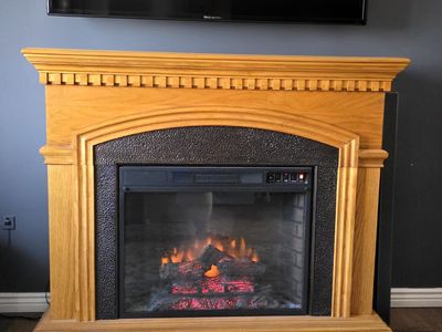 Large oak electric fireplace with blower