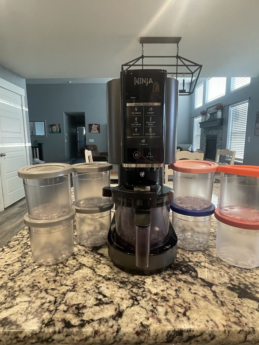 Ninja CREAMi Ice Cream Maker Machine with 9 Containers and Lids.