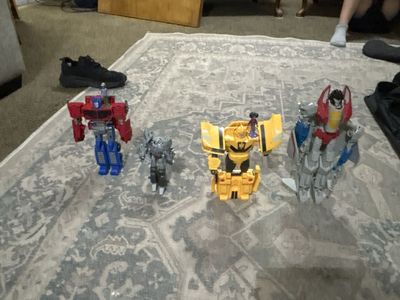 Transformers Figures Lot: Optimus Prime, Megatron, Bumblebee, Starscream - Robot to Vehicle Set