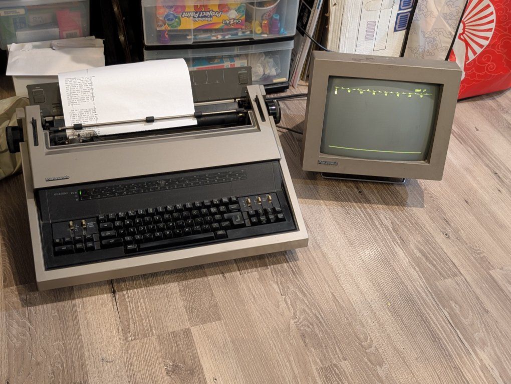 Panasonic KX-E700m Electronic Typewriter with Display, Print Ribbon, Owners Manual and Product Brochure.