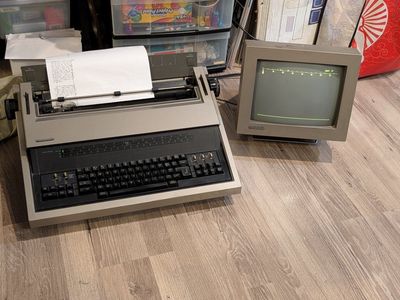 Panasonic KX-E700m Electronic Typewriter with Display, Print Ribbon, Owners Manual and Product Brochure.