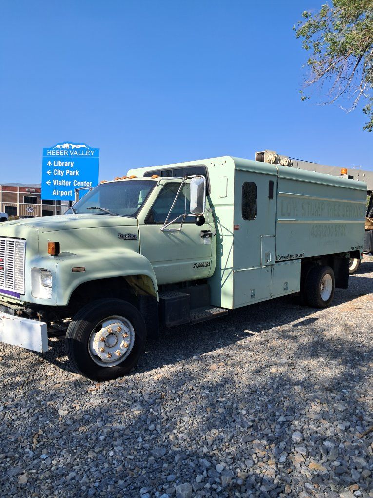 GMC Commercial Chip Dump Truck with Utility Crew Cab Body