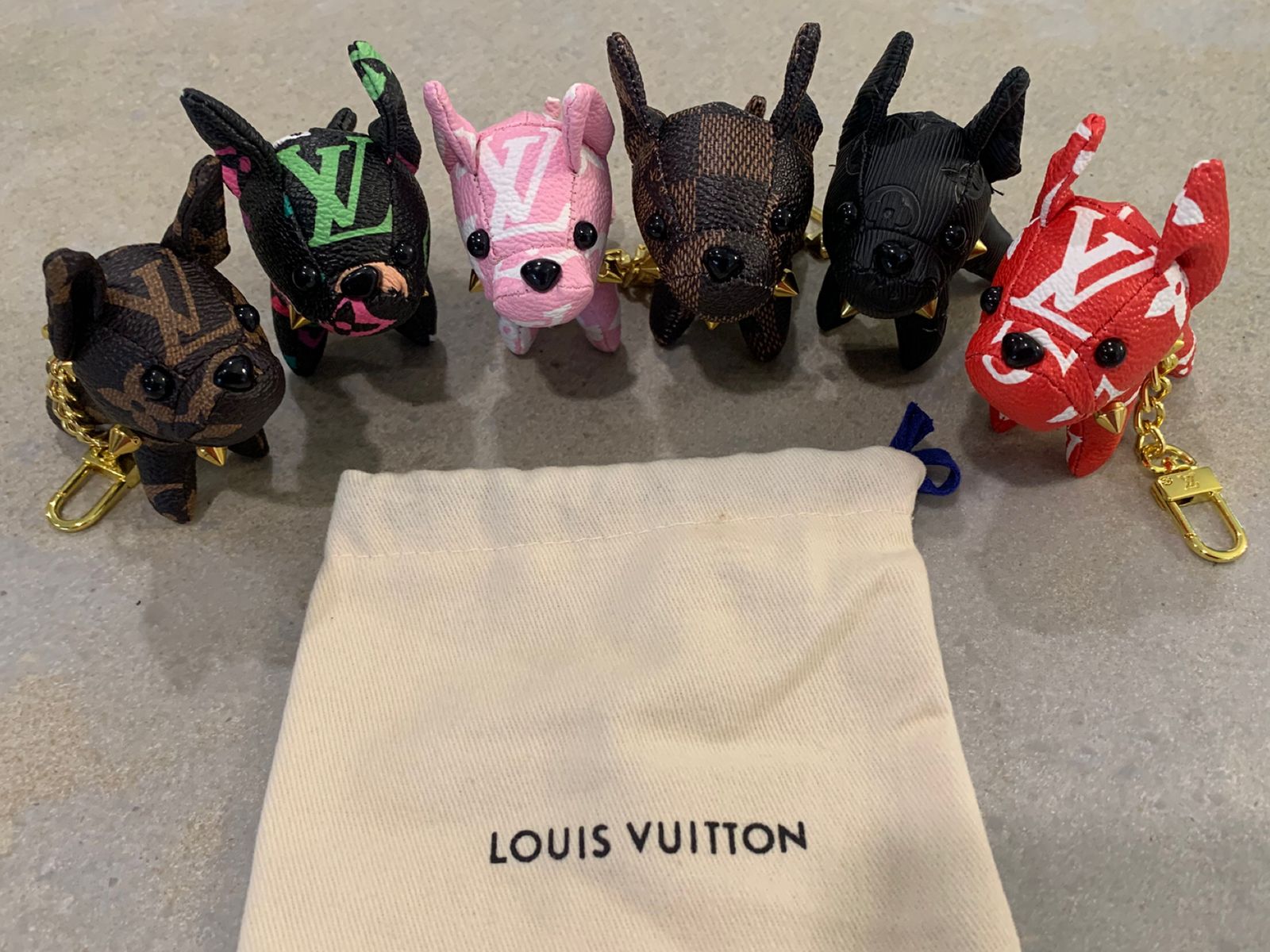 LV inspired purse charm/keychain price is for 1 please text what come you would like.