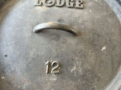 Lodge 12-Inch Cast Iron Camp Dutch Oven with Lid and Bail Handle