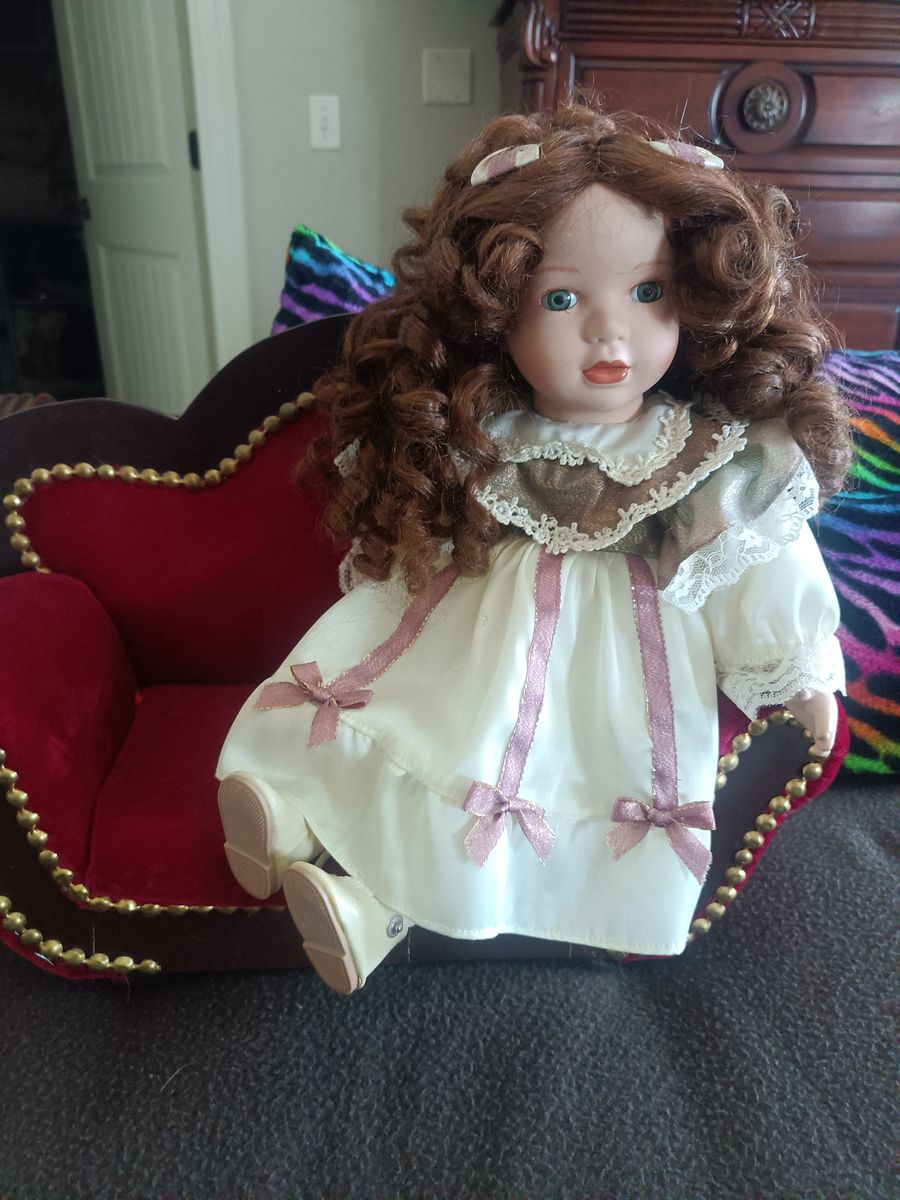 Porcelain Doll on a Chaise
