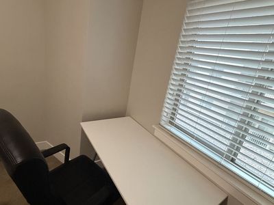 White Writing Desk and Black Leather Executive Office Chair Set