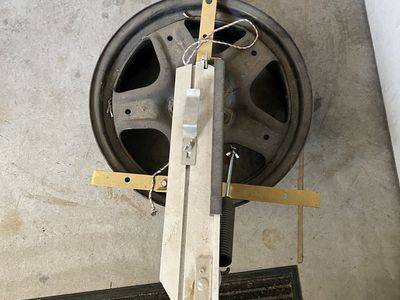 Manual spring loaded trap thrower