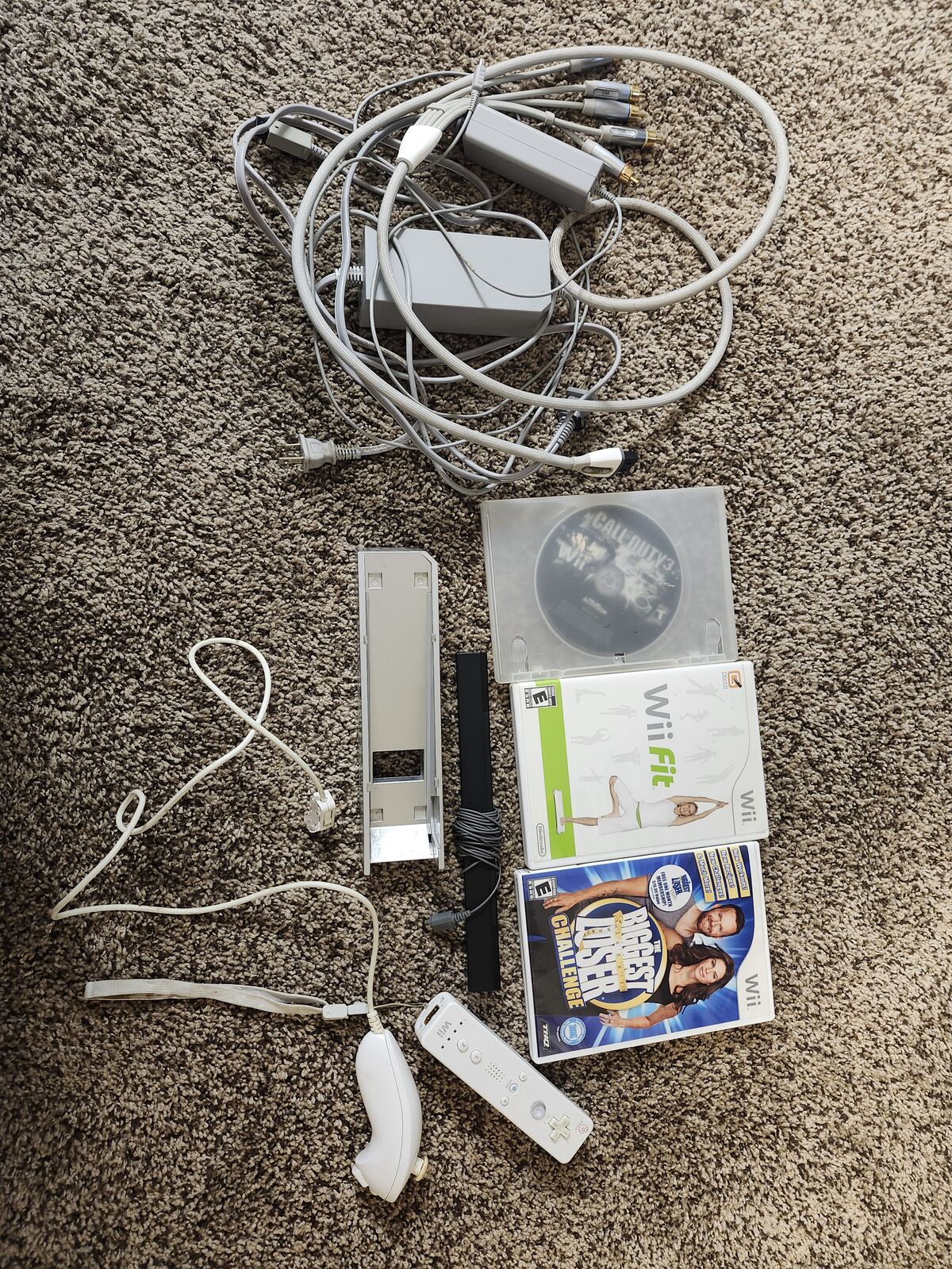 Various Wii cords and controller/nunchuck + 3 games