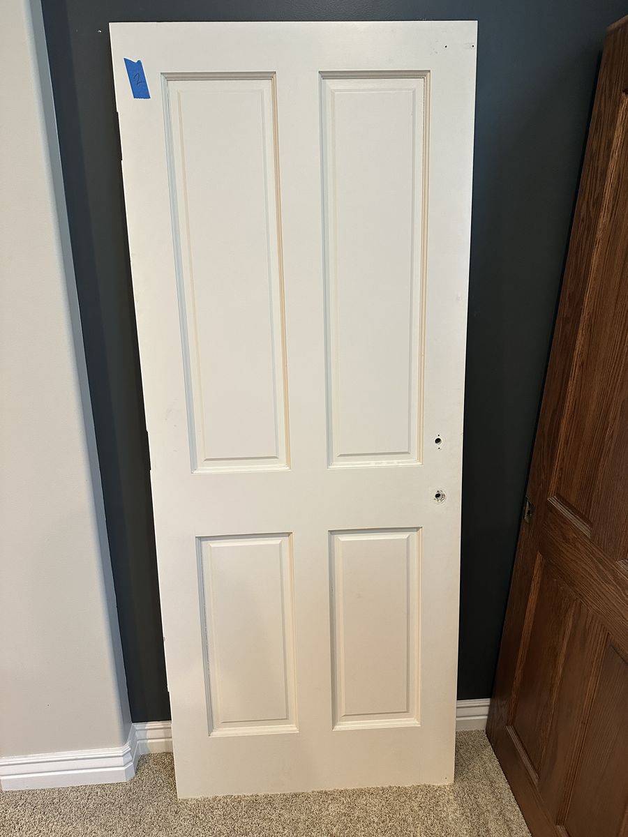 Quality solid wood interior doors removed during a remodel. These are not hollow-core or MDF—they are solid wood construction.