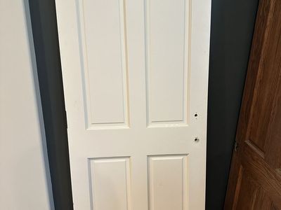 Quality solid wood interior doors removed during a remodel. These are not hollow-core or MDF—they are solid wood construction.