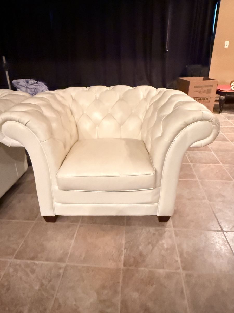 Two White Faux Leather Chairs