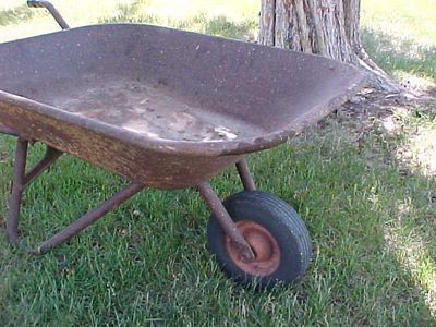 Antique wheel barrow...good shape...original patina...great yard art or use it .