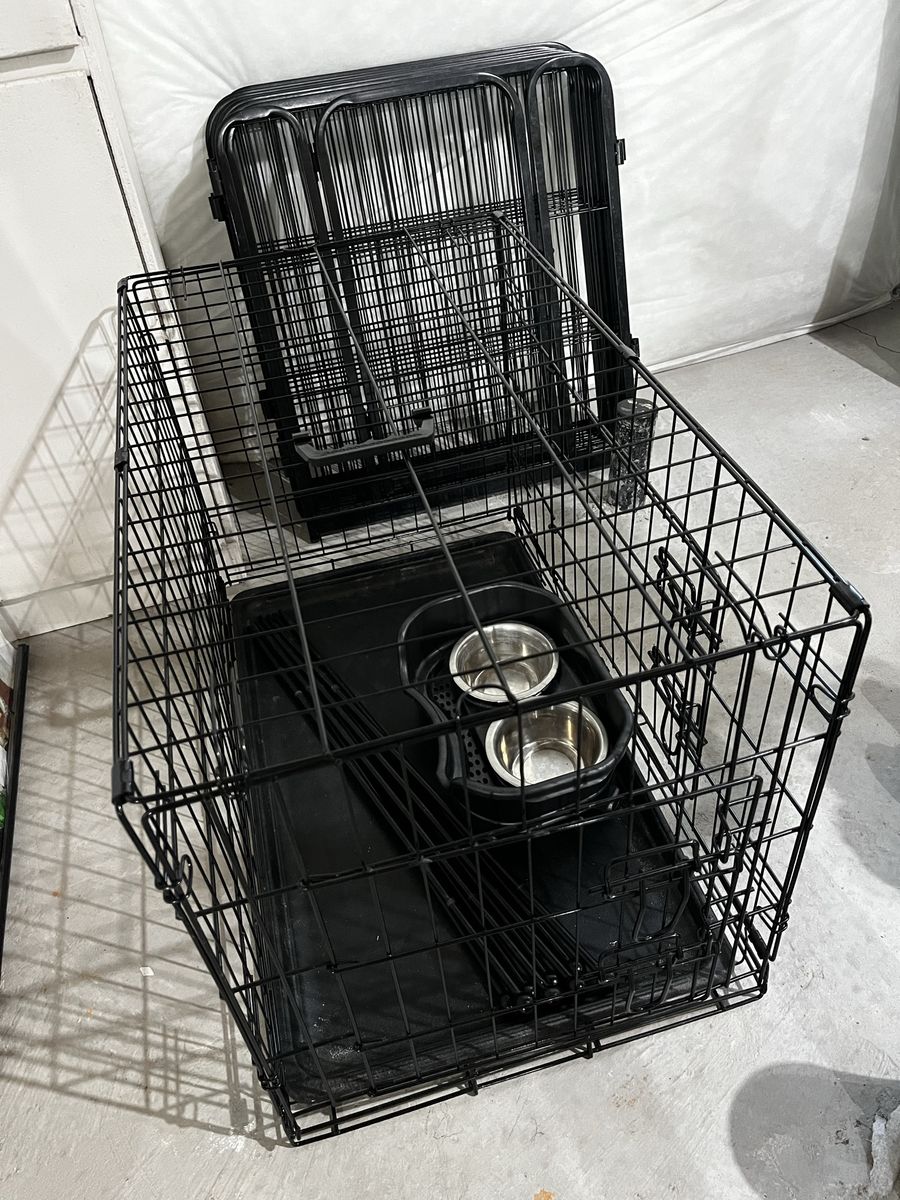 Petmate Black Wire Dog Crate Kennel with Double Door, Medium—Large, Includes Feeder Bowls and 16 Foot Fence.