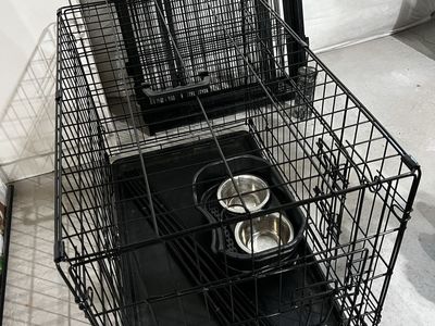 Petmate Black Wire Dog Crate Kennel with Double Door, Medium—Large, Includes Feeder Bowls and 16 Foot Fence.