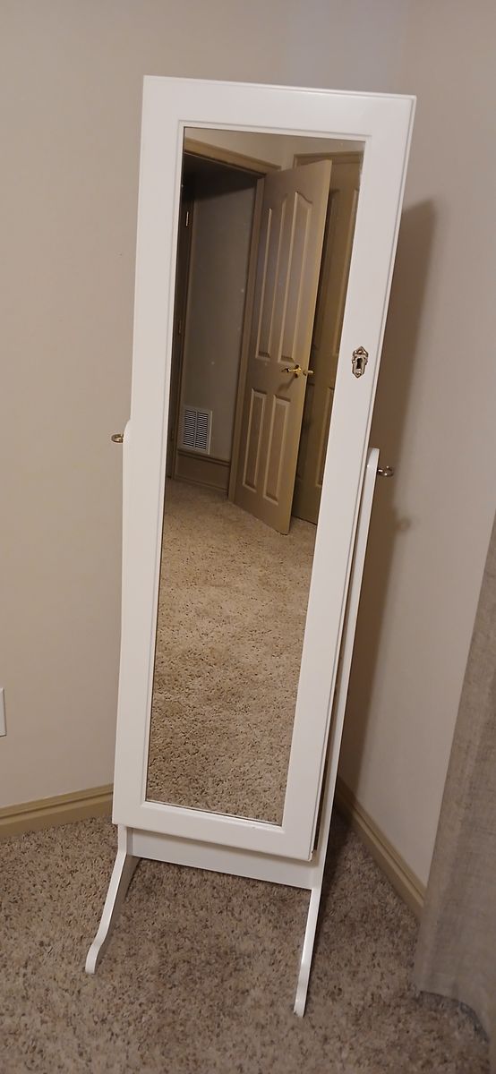 Standing mirror with built-in jewelry storage
