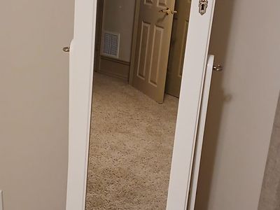 Standing mirror with built-in jewelry storage