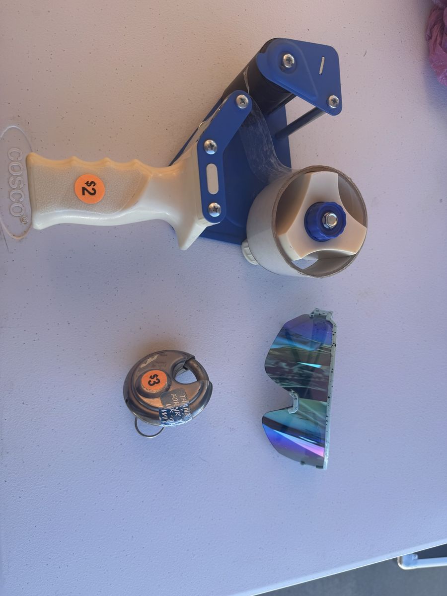Packing tape, sunglasses, storage unit lock with key