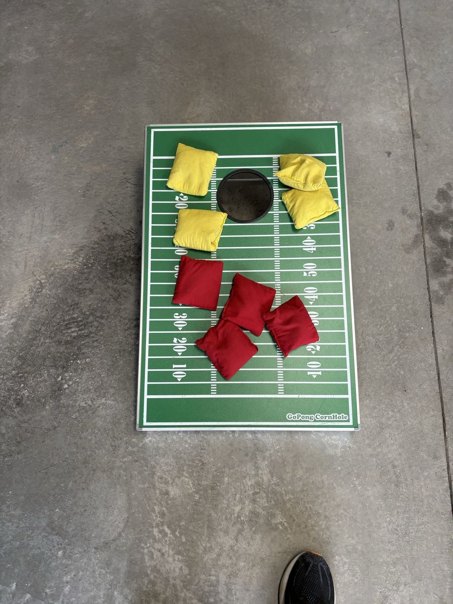 GoPong Football Cornhole Game Set with Red and Yellow Bean Bags