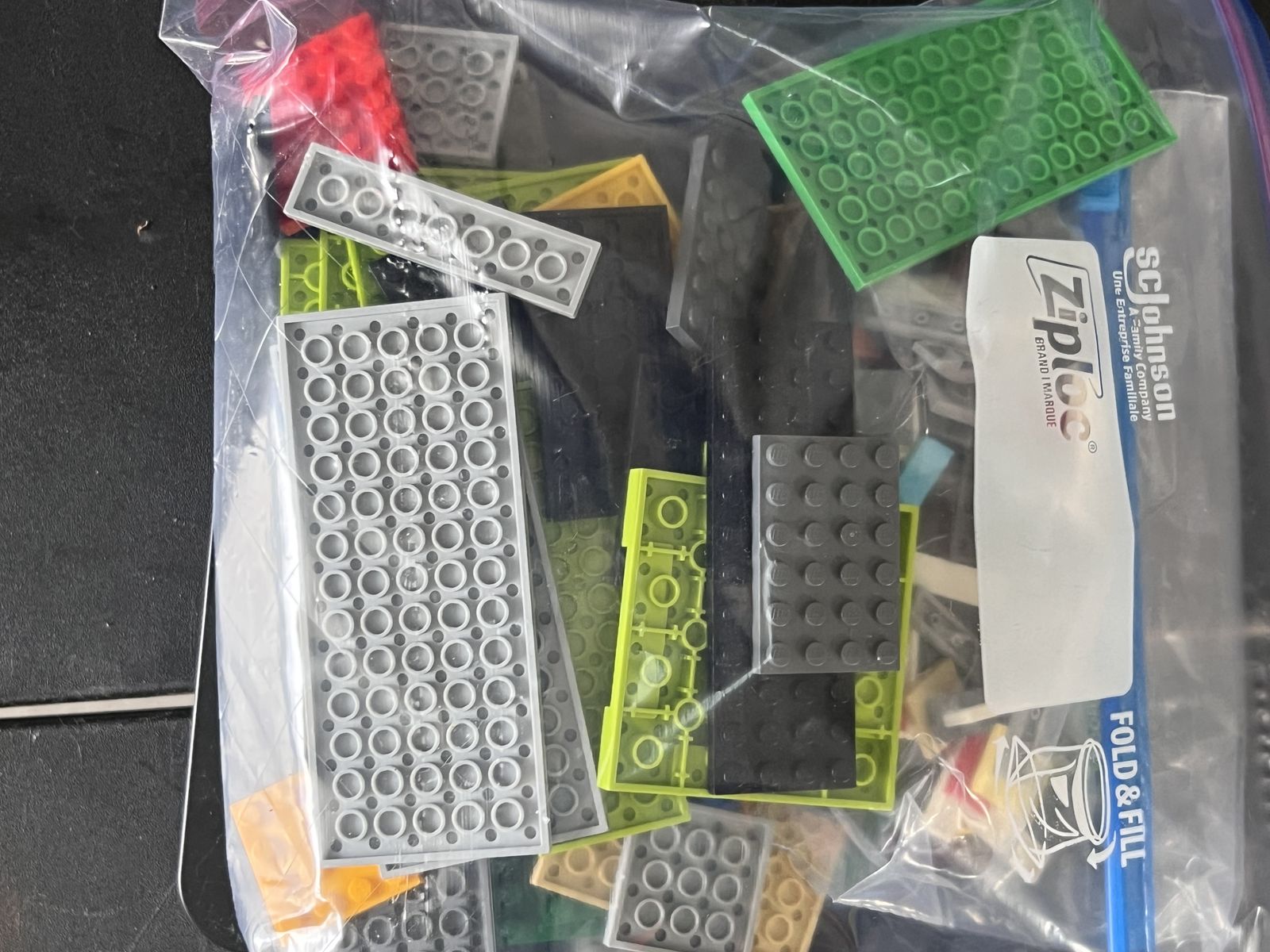 Large LEGO lot including Minecraft set 21113 (The Cave) with box plus several bags of assorted LEGO pieces.