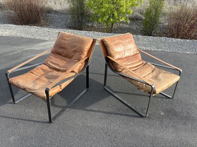 Beautiful genuine leather accent chairs. Down filled cushions. Orig over $1,400 each new Great for Mid Century Modern MCM