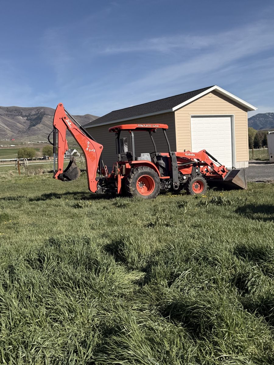 Kubota M62 Tractor, Loader, Backhoe