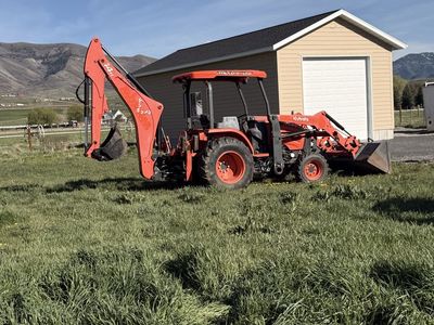 Kubota M62 Tractor, Loader, Backhoe