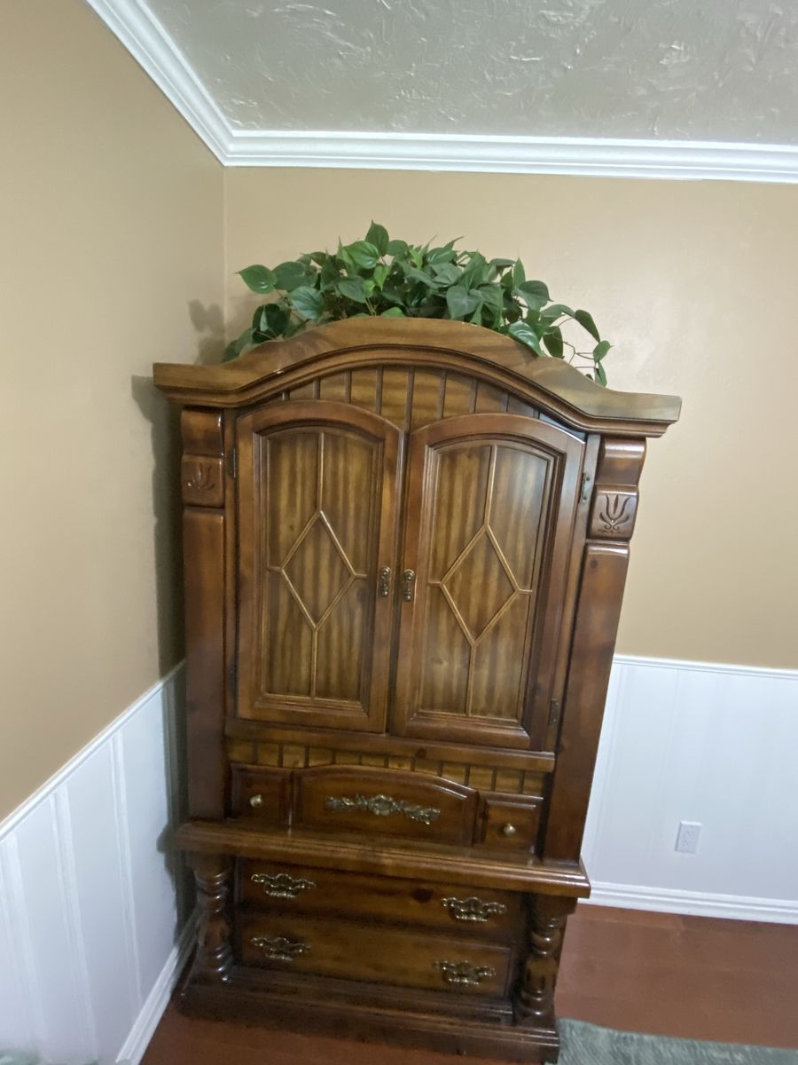 Armoire with Drawers and Cabinet Storage.