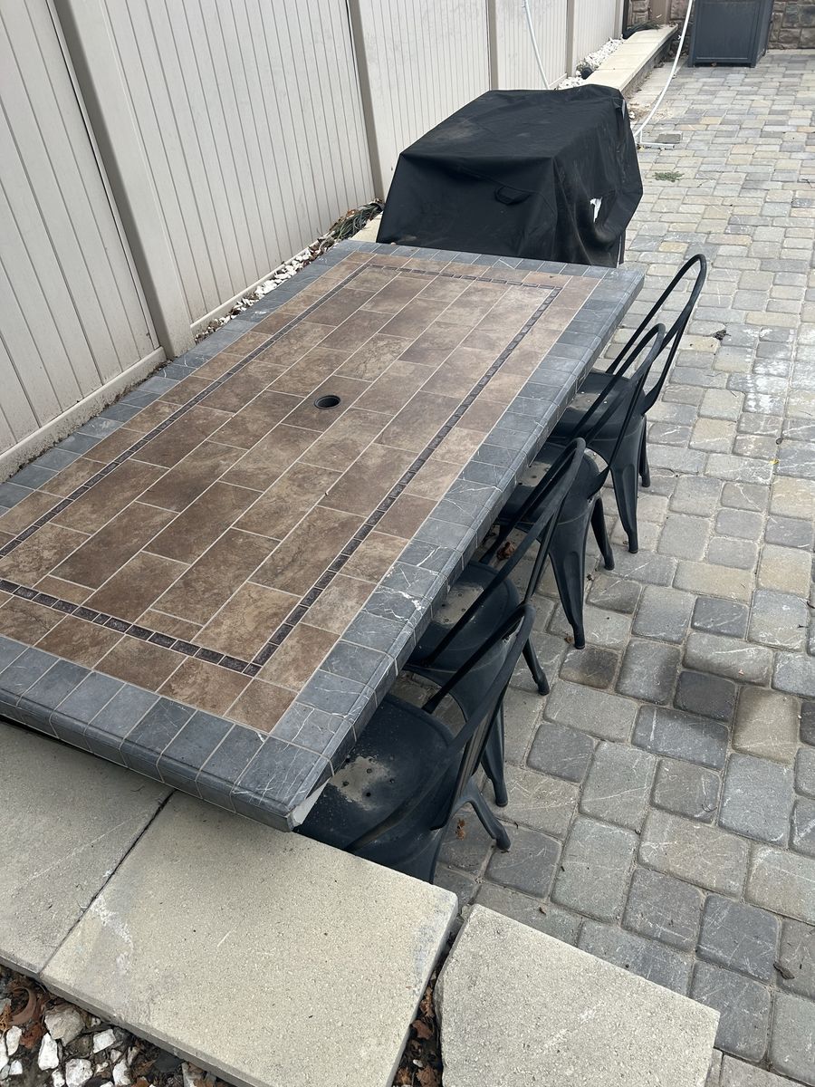 Outdoor Tile Top Patio Dining Table with Matching Black Chairs