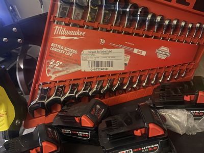 Milwaukee batteries and wrenches