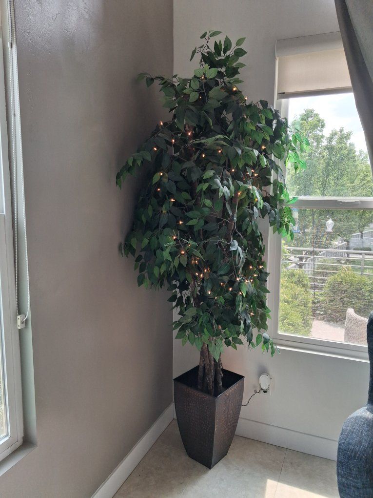 96" tall artificial tree with lights.