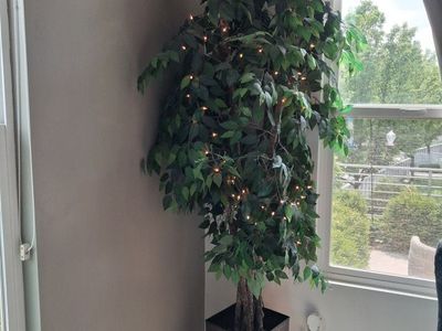 96" tall artificial tree with lights.
