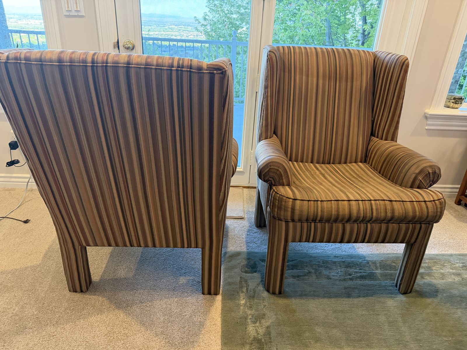 Two Well-used Wingback Armchairs