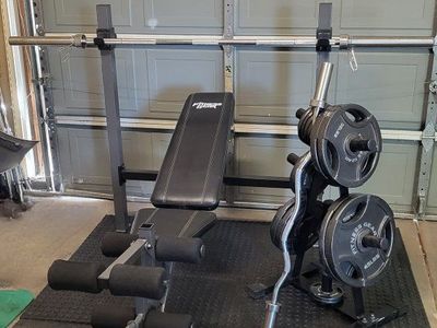 Bench and 255 pounds of weights