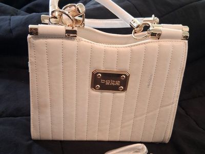 Bebe Quilted White Handbag with Gold Hardware and Removable Strap