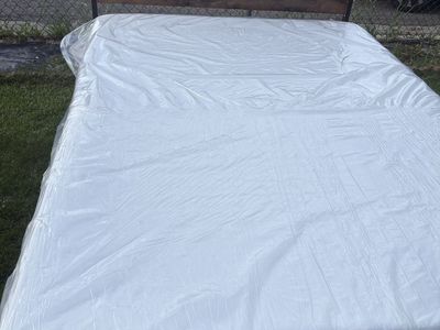 Brand new queen size bed with mattress
